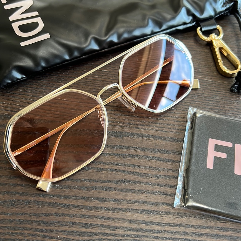 Fendi Hexagonal O’Lock sunglasses. Gold frame and Pink/Purple Lense